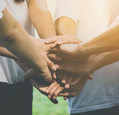 Group of people holding hands