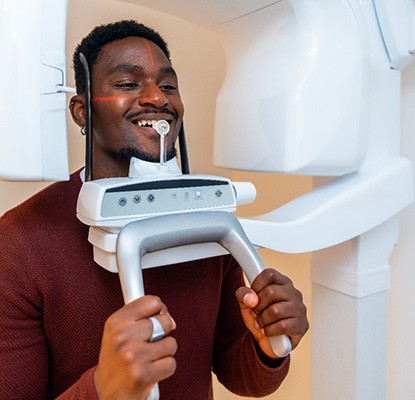 a man having scans taken with a cone beam CT scanner