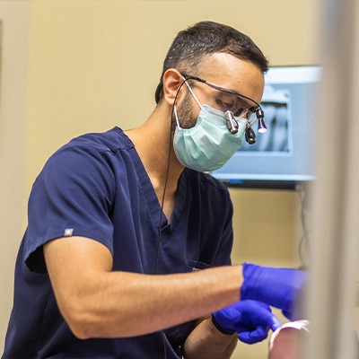 Man with glass concentrating