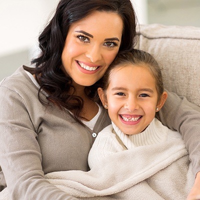 Smiling mother and daughter
