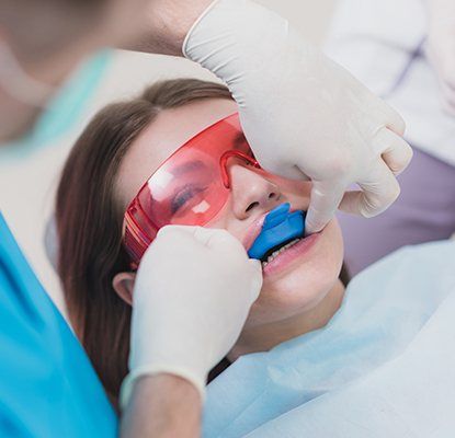 Child receiving fluoride treatment