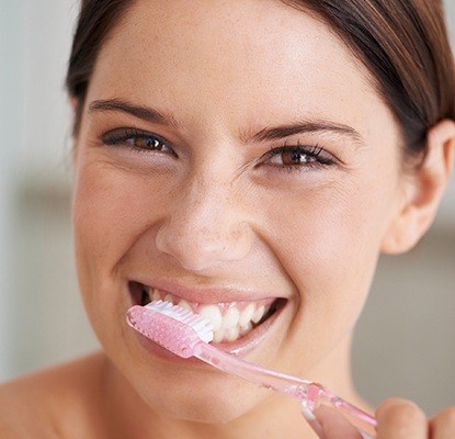 Woman brushing teeth