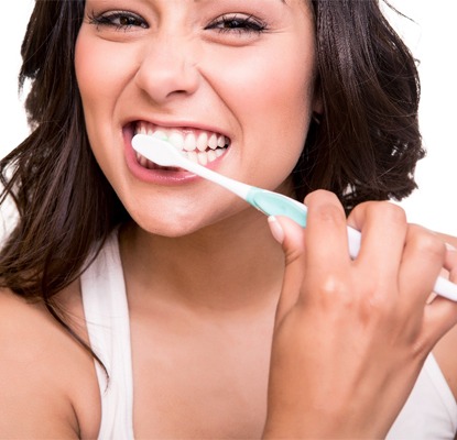 A woman brushing her teeth