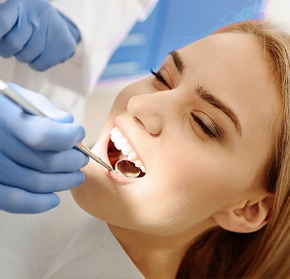 Woman receiving dental exam