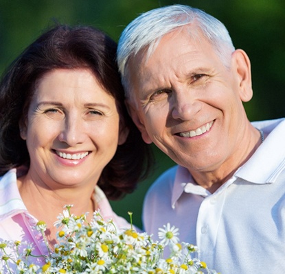 older couple smiling and hugging