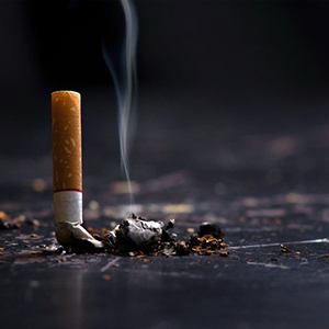 Snuffed cigarette still smolders?