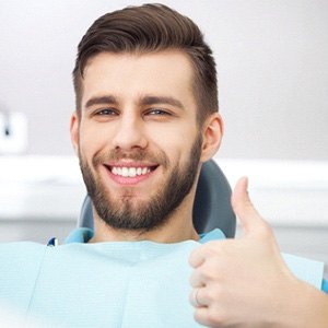 a dental implant patient smiling