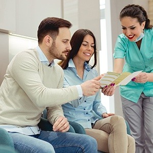 a person reading about dental implants