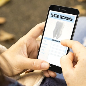 Using mobile phone to look up dental insurance information