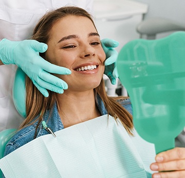 Woman smiling after treatment with Invisalign in East York