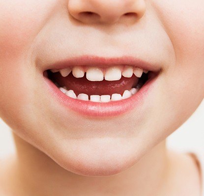 Closeup of child's healthy smile