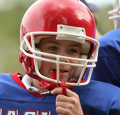 Preteen boy placing sportsguard