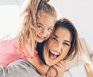 Mother and daughter laughing together