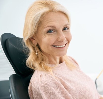 a patient smiling after undergoing dental treatment