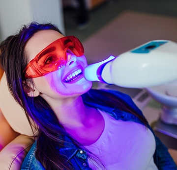 Woman getting her teeth whitened